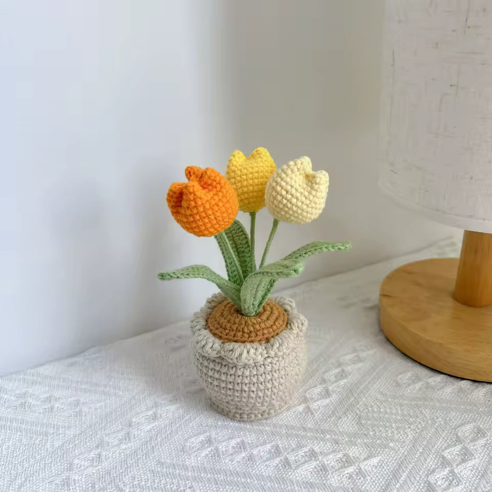 Hand-crocheted pink tulips in a knit pouch