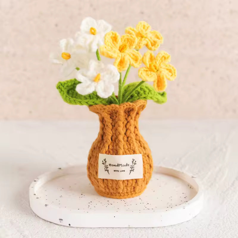 Hand-crocheted sunflowers in a cream knit pouch