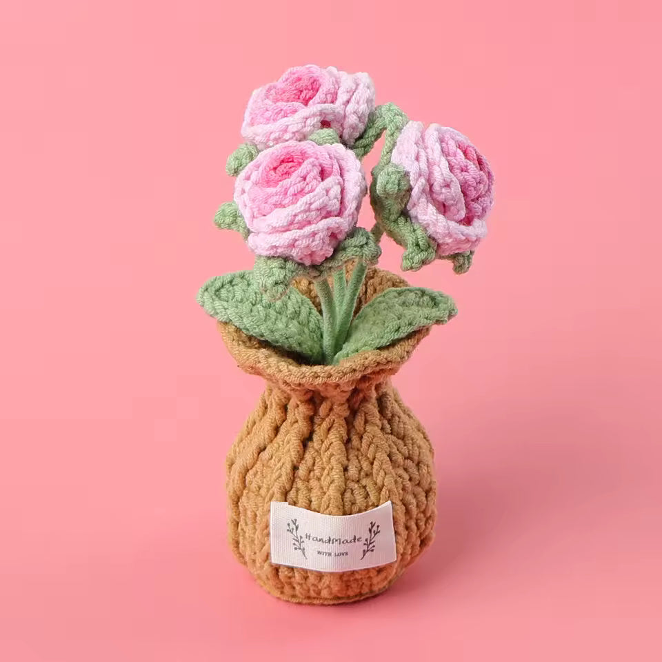 Hand-crocheted purple tulips in a knit pouch