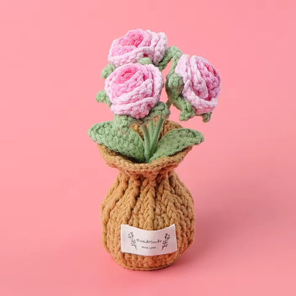Hand-crocheted purple tulips in a knit pouch