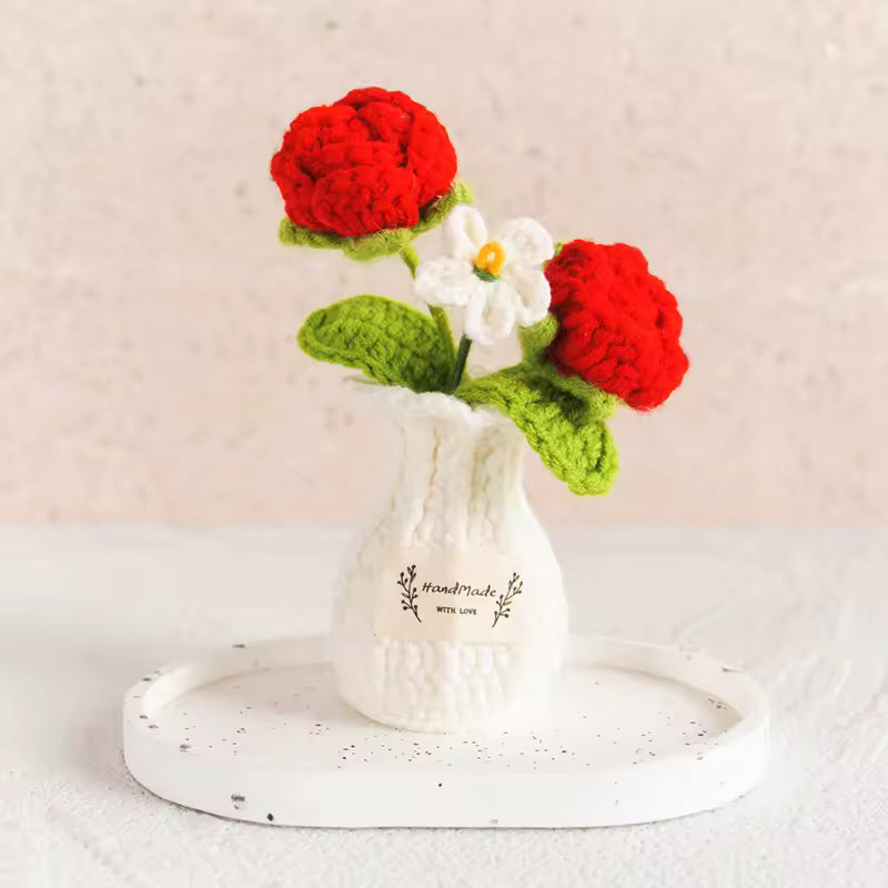 Hand-crocheted purple daisies in a mustard vase