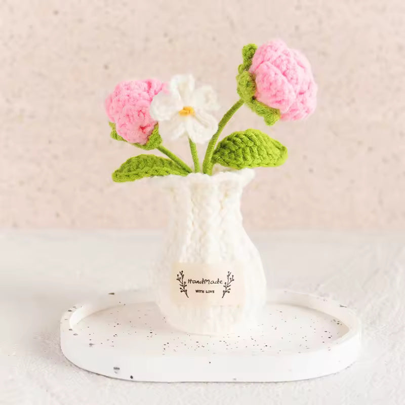 Hand-crocheted pink bobble flowers with white daisy