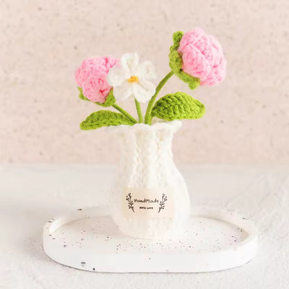 Hand-crocheted pink bobble flowers with white daisy